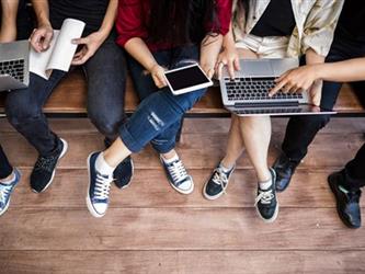 Students reading on electronic devices